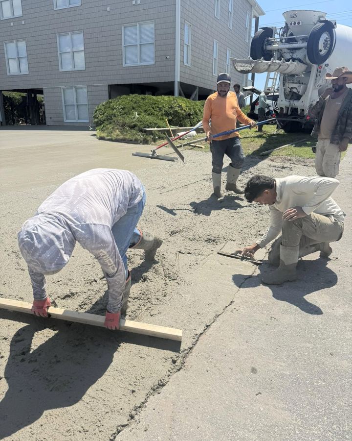 Crew finishing a concrete pour