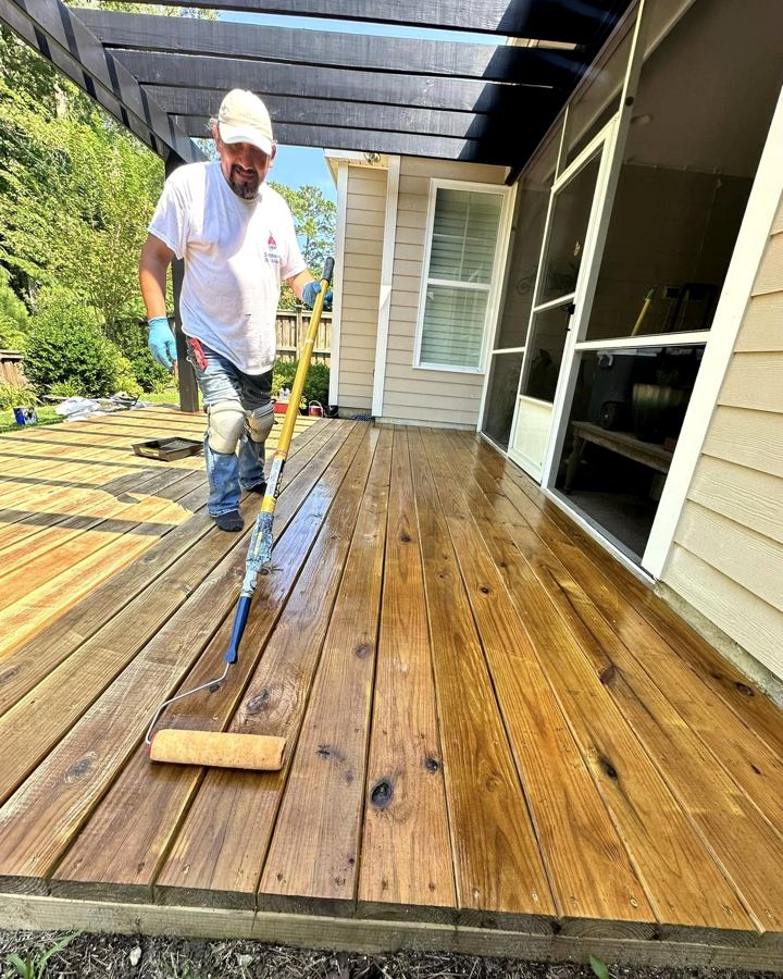 Staining a wooden deck with a roller