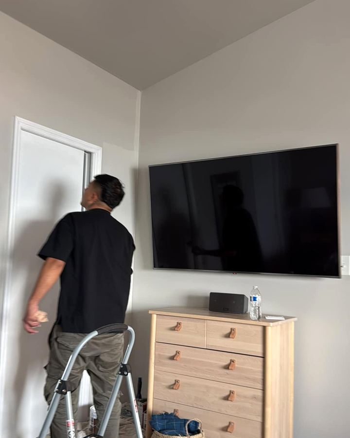 Painter finishing an interior wall