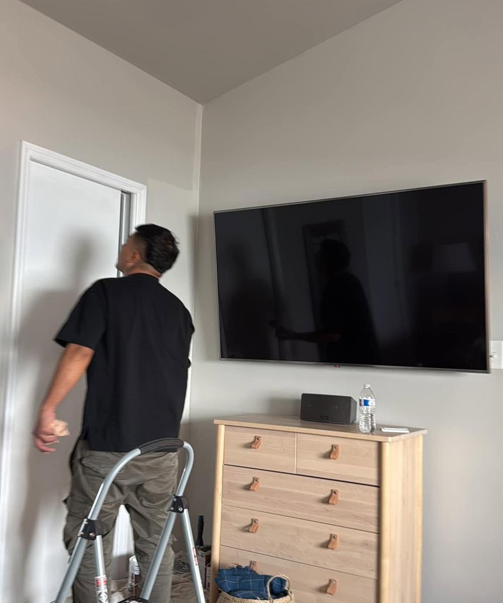 Painter finishing an interior wall
