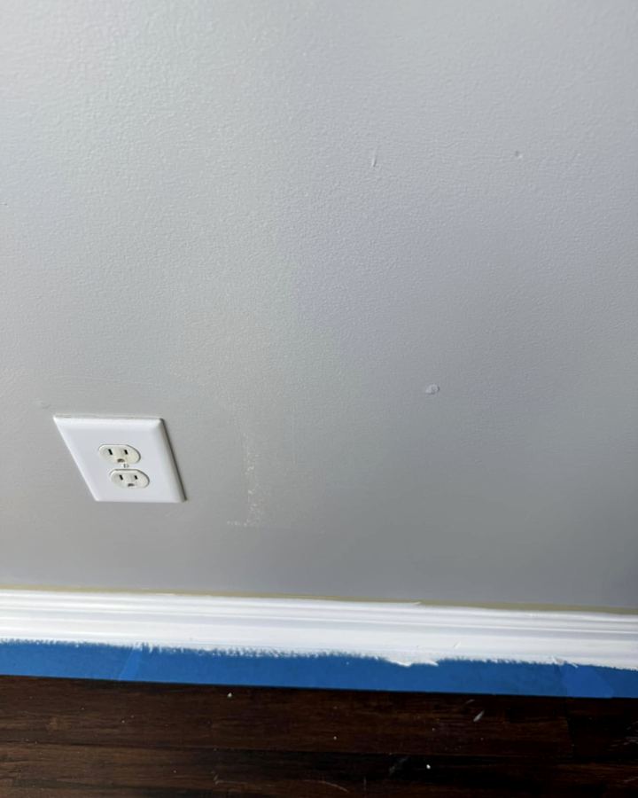 Clean paint line along a white baseboard